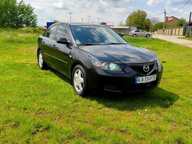 Черный Мазда 3, объемом двигателя 2 л и пробегом 245 тыс. км за 4450 $, фото 1 на Automoto.ua