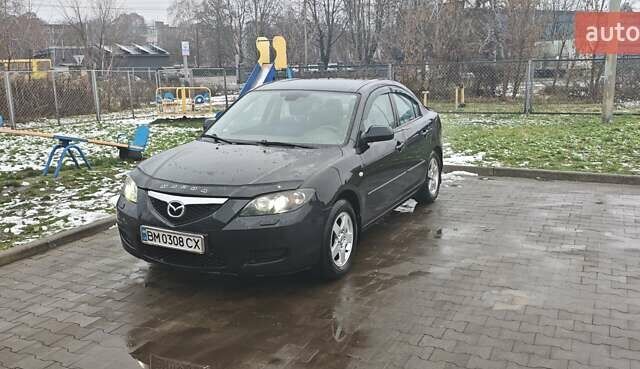 Черный Мазда 3, объемом двигателя 1.6 л и пробегом 205 тыс. км за 5600 $, фото 1 на Automoto.ua