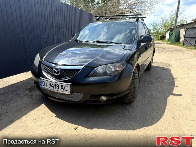 Черный Мазда 3, объемом двигателя 2 л и пробегом 322 тыс. км за 4330 $, фото 1 на Automoto.ua