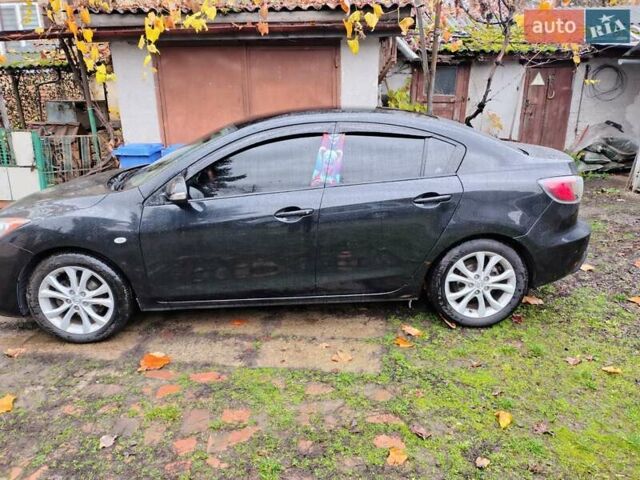 Черный Мазда 3, объемом двигателя 1.6 л и пробегом 213 тыс. км за 7500 $, фото 1 на Automoto.ua