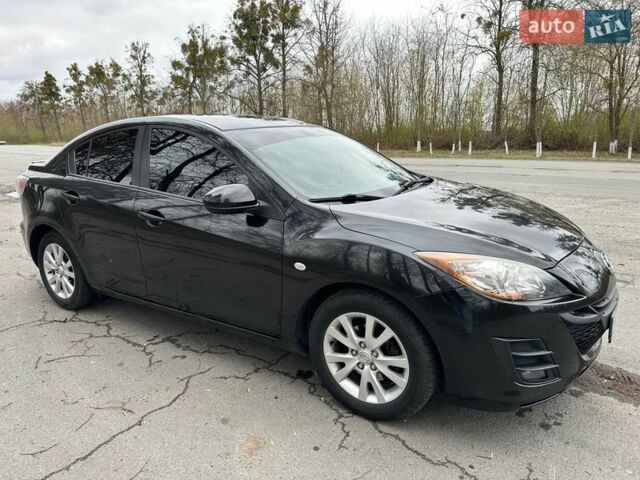 Черный Мазда 3, объемом двигателя 1.6 л и пробегом 165 тыс. км за 7650 $, фото 1 на Automoto.ua