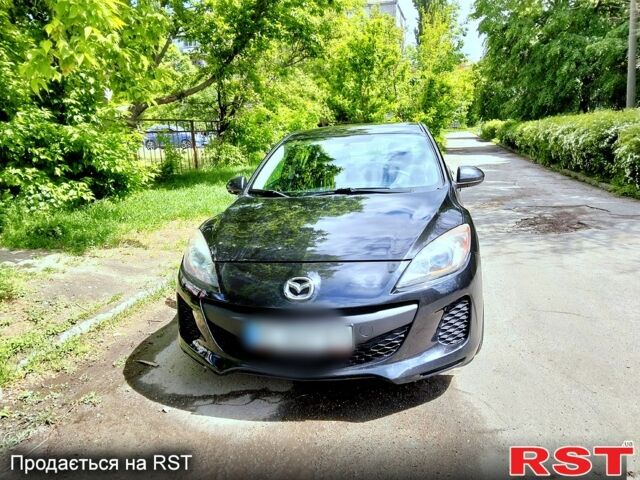 Черный Мазда 3, объемом двигателя 2 л и пробегом 220 тыс. км за 7200 $, фото 1 на Automoto.ua