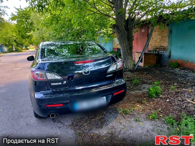 Черный Мазда 3, объемом двигателя 2 л и пробегом 225 тыс. км за 6900 $, фото 1 на Automoto.ua