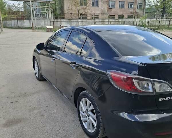 Черный Мазда 3, объемом двигателя 2 л и пробегом 264 тыс. км за 8500 $, фото 1 на Automoto.ua