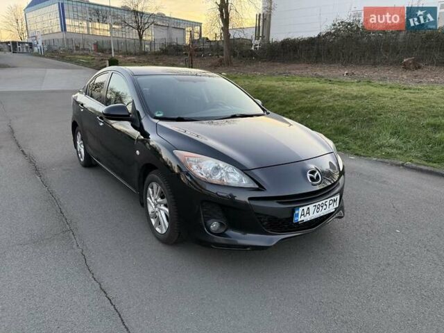 Черный Мазда 3, объемом двигателя 2 л и пробегом 170 тыс. км за 8700 $, фото 1 на Automoto.ua