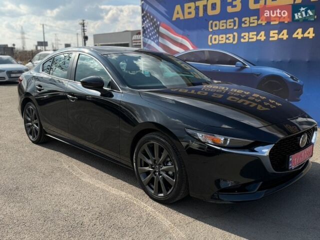 Черный Мазда 3, объемом двигателя 2.49 л и пробегом 27 тыс. км за 18300 $, фото 1 на Automoto.ua