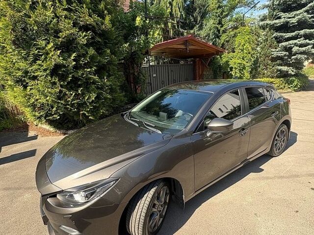 Коричневый Мазда 3, объемом двигателя 2 л и пробегом 178 тыс. км за 12800 $, фото 1 на Automoto.ua