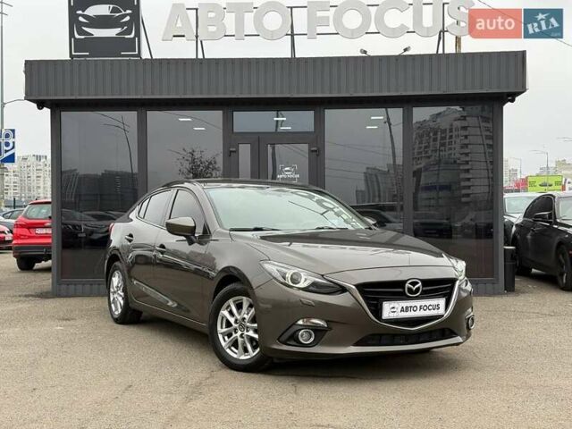 Коричневий Мазда 3, об'ємом двигуна 1.5 л та пробігом 246 тис. км за 11690 $, фото 1 на Automoto.ua