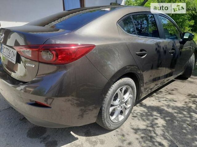 Коричневый Мазда 3, объемом двигателя 2 л и пробегом 182 тыс. км за 10288 $, фото 1 на Automoto.ua