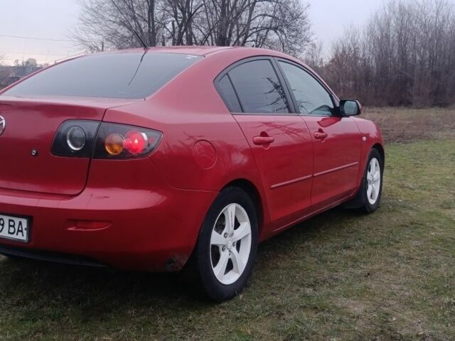 Красный Мазда 3, объемом двигателя 2 л и пробегом 203 тыс. км за 4250 $, фото 1 на Automoto.ua