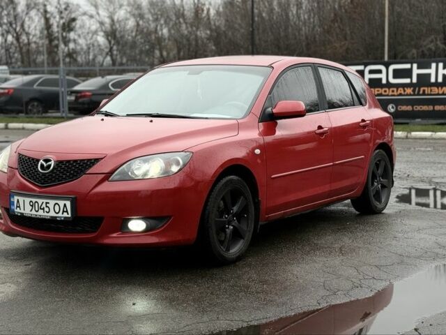 Красный Мазда 3, объемом двигателя 1.6 л и пробегом 249 тыс. км за 5699 $, фото 1 на Automoto.ua
