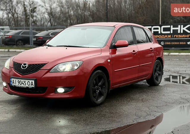Красный Мазда 3, объемом двигателя 1.6 л и пробегом 249 тыс. км за 5699 $, фото 1 на Automoto.ua