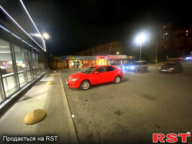 Красный Мазда 3, объемом двигателя 1.6 л и пробегом 199 тыс. км за 5800 $, фото 1 на Automoto.ua