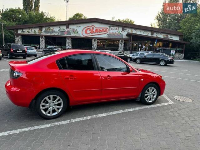 Красный Мазда 3, объемом двигателя 1.6 л и пробегом 131 тыс. км за 6600 $, фото 1 на Automoto.ua