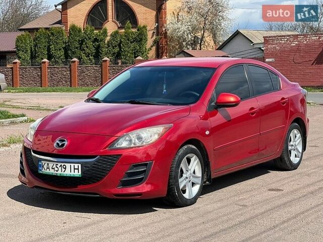 Красный Мазда 3, объемом двигателя 2 л и пробегом 200 тыс. км за 6500 $, фото 1 на Automoto.ua