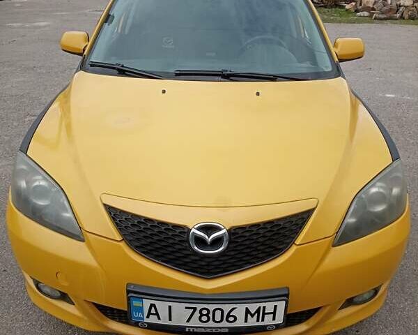 Желтый Мазда 3, объемом двигателя 2 л и пробегом 330 тыс. км за 2800 $, фото 1 на Automoto.ua