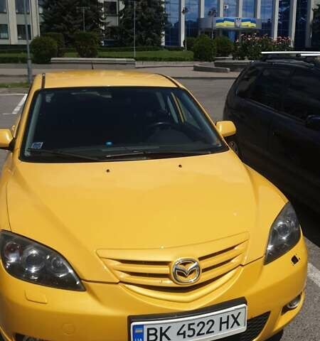 Желтый Мазда 3, объемом двигателя 2 л и пробегом 270 тыс. км за 4000 $, фото 1 на Automoto.ua