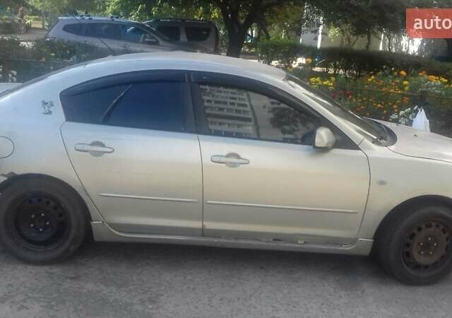 Жовтий Мазда 3, об'ємом двигуна 2 л та пробігом 240 тис. км за 3200 $, фото 1 на Automoto.ua