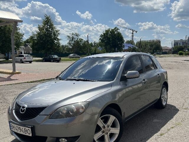 Серый Мазда 3, объемом двигателя 1.6 л и пробегом 254 тыс. км за 4350 $, фото 1 на Automoto.ua