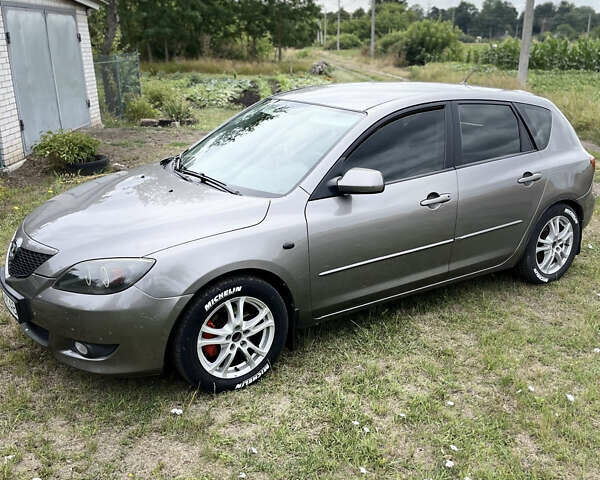 Серый Мазда 3, объемом двигателя 1.6 л и пробегом 260 тыс. км за 3800 $, фото 1 на Automoto.ua