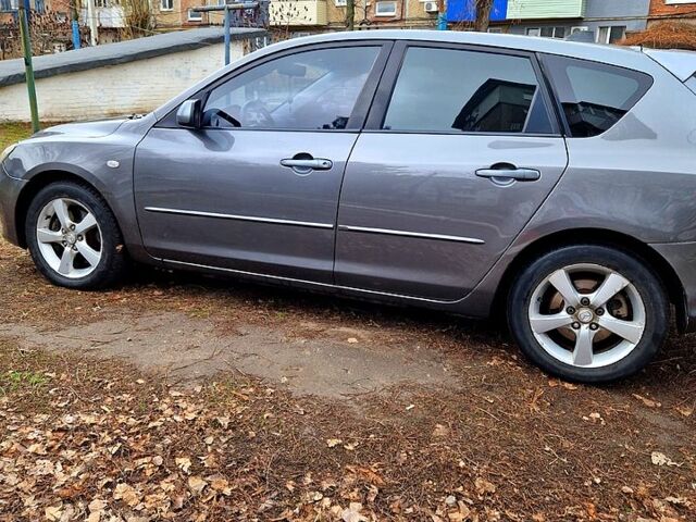 Сірий Мазда 3, об'ємом двигуна 2 л та пробігом 203 тис. км за 4200 $, фото 1 на Automoto.ua