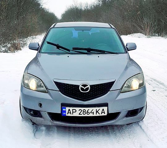 Серый Мазда 3, объемом двигателя 1.6 л и пробегом 200 тыс. км за 3900 $, фото 1 на Automoto.ua