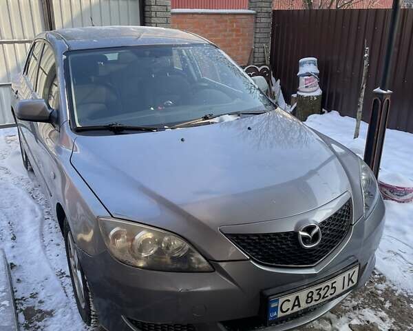 Серый Мазда 3, объемом двигателя 1.6 л и пробегом 215 тыс. км за 3800 $, фото 1 на Automoto.ua