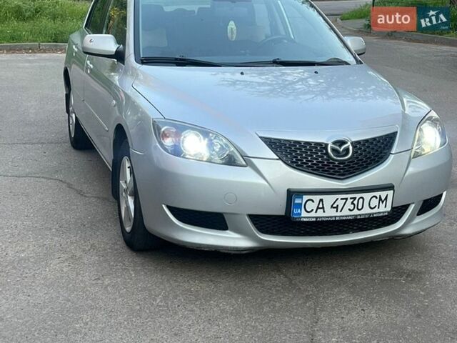 Серый Мазда 3, объемом двигателя 1.6 л и пробегом 219 тыс. км за 4100 $, фото 1 на Automoto.ua
