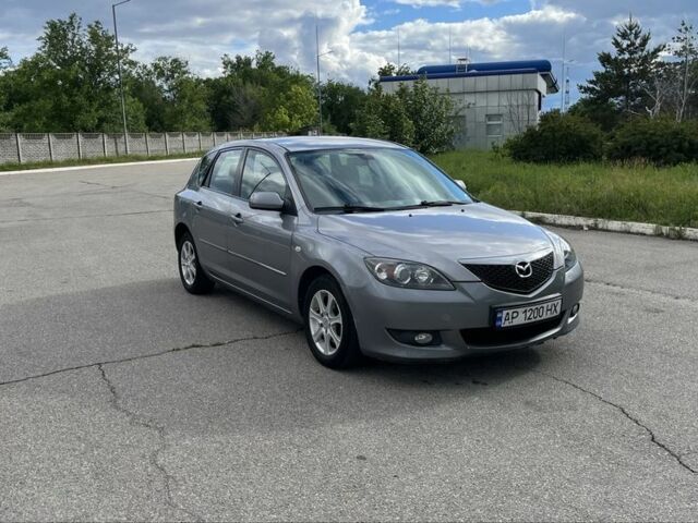 Серый Мазда 3, объемом двигателя 1.6 л и пробегом 294 тыс. км за 3850 $, фото 1 на Automoto.ua