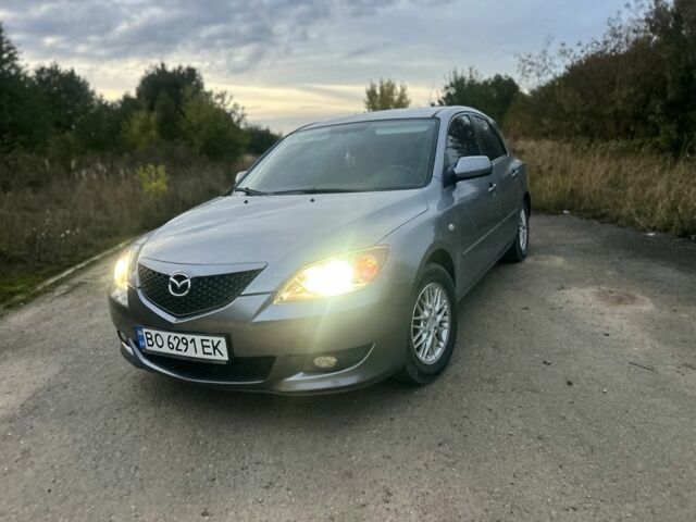Серый Мазда 3, объемом двигателя 1.6 л и пробегом 320 тыс. км за 3317 $, фото 1 на Automoto.ua