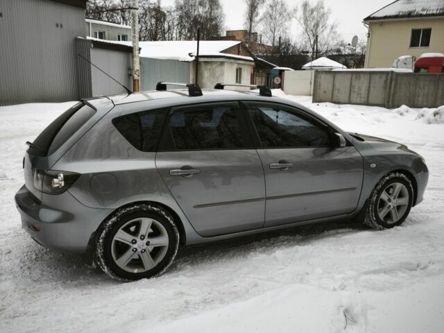Серый Мазда 3, объемом двигателя 2 л и пробегом 290 тыс. км за 5700 $, фото 1 на Automoto.ua