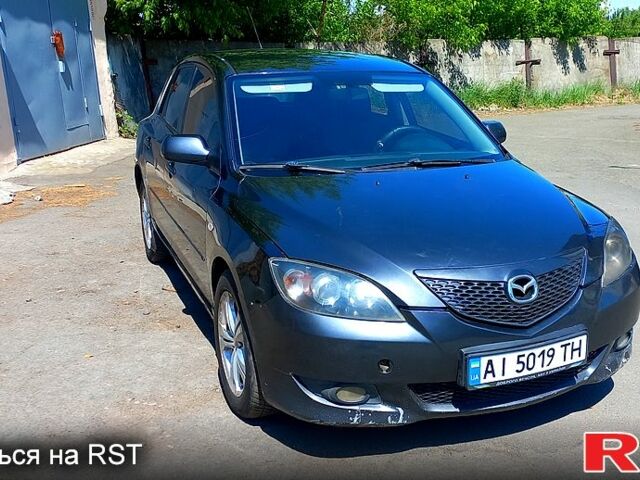 Серый Мазда 3, объемом двигателя 1.6 л и пробегом 265 тыс. км за 3200 $, фото 1 на Automoto.ua