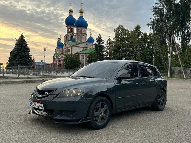 Серый Мазда 3, объемом двигателя 2 л и пробегом 411 тыс. км за 4200 $, фото 1 на Automoto.ua