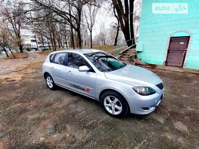 Серый Мазда 3, объемом двигателя 1.6 л и пробегом 306 тыс. км за 4700 $, фото 1 на Automoto.ua