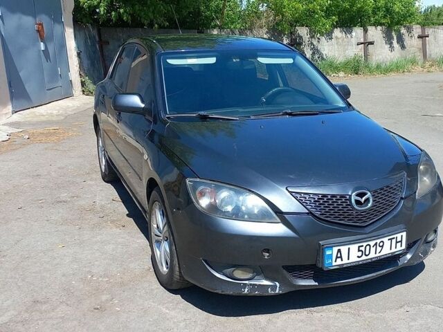 Серый Мазда 3, объемом двигателя 1.6 л и пробегом 265 тыс. км за 2700 $, фото 1 на Automoto.ua