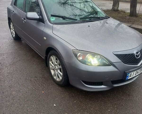 Серый Мазда 3, объемом двигателя 1.6 л и пробегом 286 тыс. км за 5500 $, фото 1 на Automoto.ua