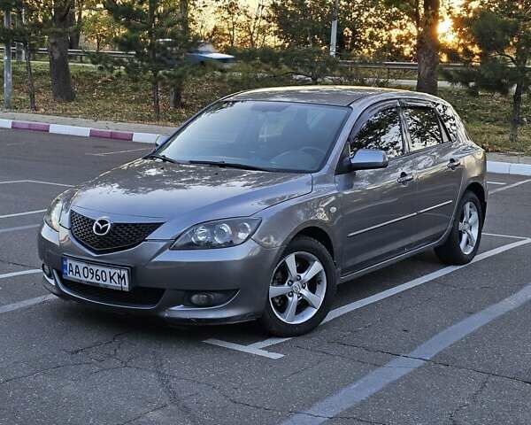 Серый Мазда 3, объемом двигателя 1.6 л и пробегом 235 тыс. км за 4999 $, фото 1 на Automoto.ua