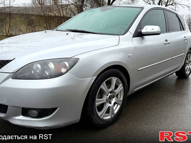 Серый Мазда 3, объемом двигателя 1.3 л и пробегом 284 тыс. км за 3600 $, фото 1 на Automoto.ua