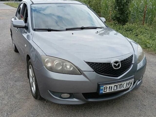 Серый Мазда 3, объемом двигателя 1.6 л и пробегом 296 тыс. км за 3588 $, фото 1 на Automoto.ua