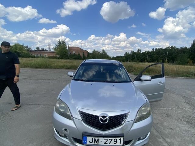 Серый Мазда 3, объемом двигателя 1.6 л и пробегом 350 тыс. км за 900 $, фото 1 на Automoto.ua