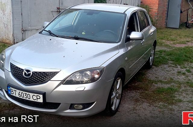Серый Мазда 3, объемом двигателя 2 л и пробегом 230 тыс. км за 3100 $, фото 1 на Automoto.ua