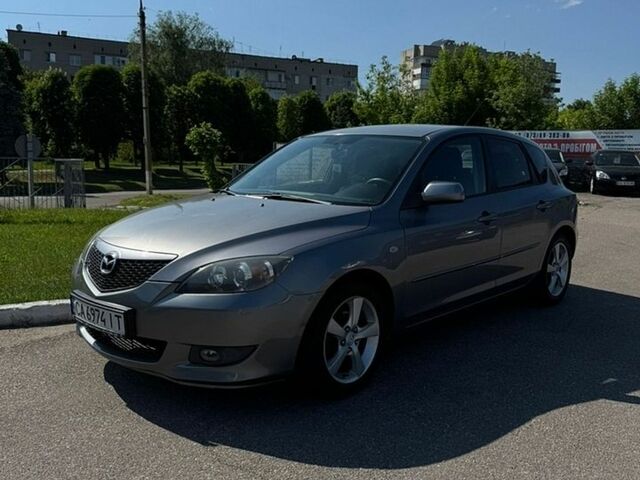 Серый Мазда 3, объемом двигателя 1.6 л и пробегом 215 тыс. км за 4800 $, фото 1 на Automoto.ua