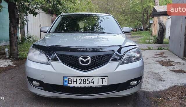 Серый Мазда 3, объемом двигателя 1.6 л и пробегом 297 тыс. км за 5600 $, фото 1 на Automoto.ua