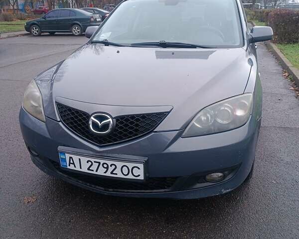 Серый Мазда 3, объемом двигателя 1.56 л и пробегом 269 тыс. км за 5200 $, фото 1 на Automoto.ua