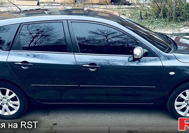 Серый Мазда 3, объемом двигателя 1.6 л и пробегом 173 тыс. км за 4999 $, фото 1 на Automoto.ua
