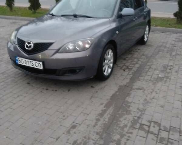 Серый Мазда 3, объемом двигателя 1.6 л и пробегом 128 тыс. км за 4850 $, фото 1 на Automoto.ua