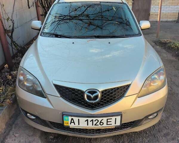 Серый Мазда 3, объемом двигателя 1.6 л и пробегом 185 тыс. км за 5999 $, фото 1 на Automoto.ua
