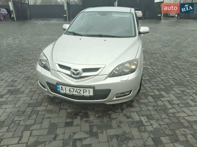 Серый Мазда 3, объемом двигателя 2 л и пробегом 250 тыс. км за 4600 $, фото 1 на Automoto.ua