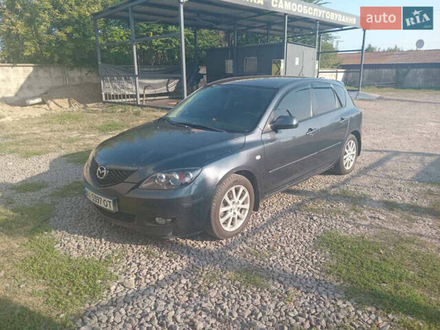 Серый Мазда 3, объемом двигателя 1.6 л и пробегом 215 тыс. км за 5650 $, фото 1 на Automoto.ua