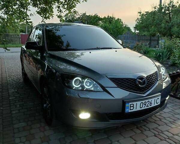 Серый Мазда 3, объемом двигателя 1.6 л и пробегом 213 тыс. км за 5500 $, фото 1 на Automoto.ua